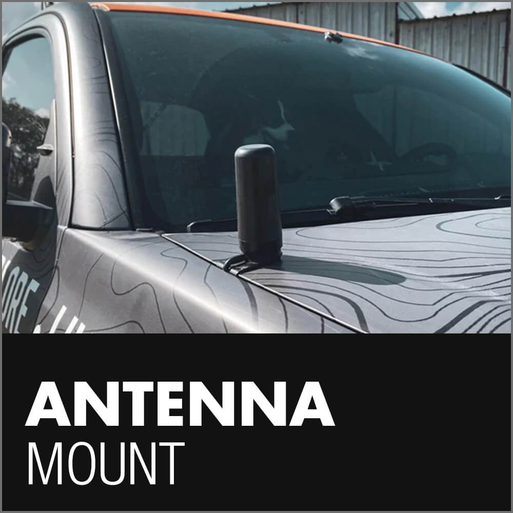 An antenna mounted on the hood of a Toyota Tacoma, with the words 'Antenna Mount' displayed below, indicating a vehicle customization accessory