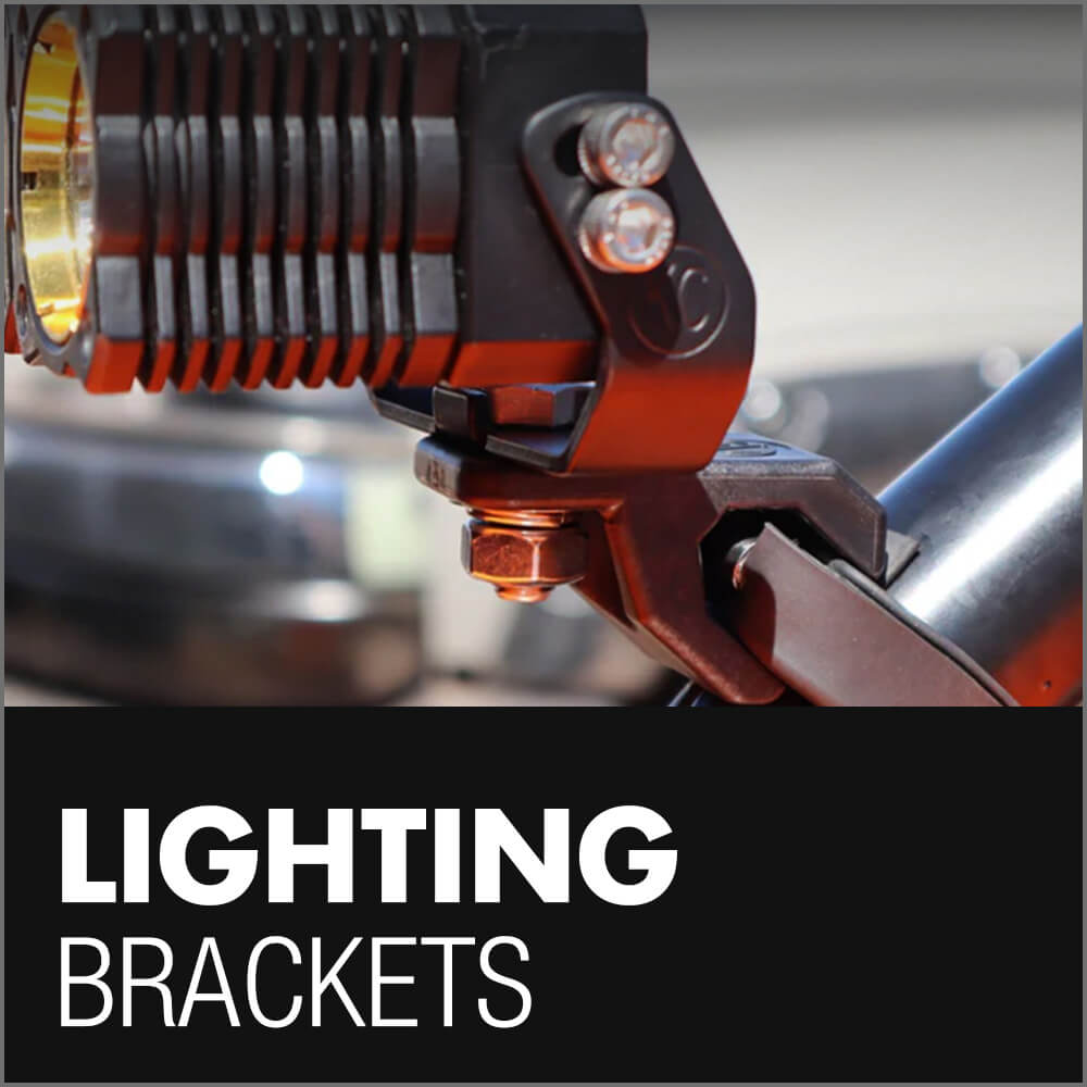 Close-up of a metal lighting bracket attached to a cylindrical light on a bar, with the text 'Lighting Brackets' below referring to light bar brackets for Toyota Tacoma